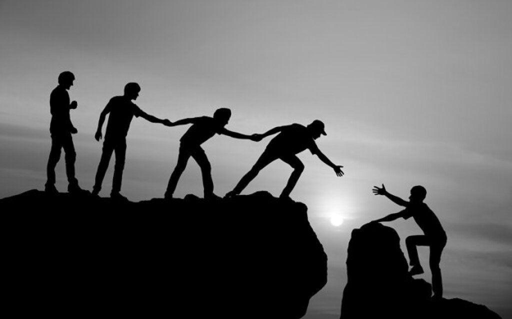 Figures climbing a mountain.