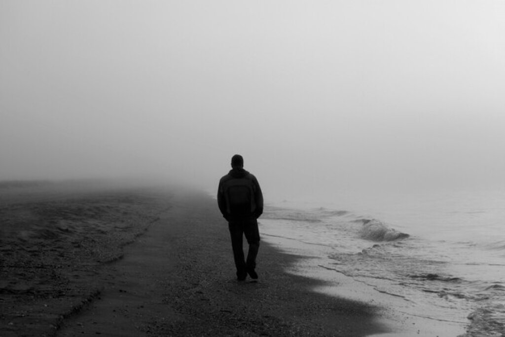 Man walking on beach.